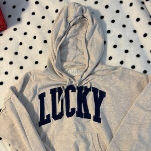 Lucky Brand Cropped Gray Hoodie with Navy Lettering. Front pocket.